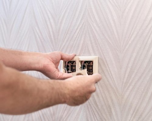 Electrician checking outlets
