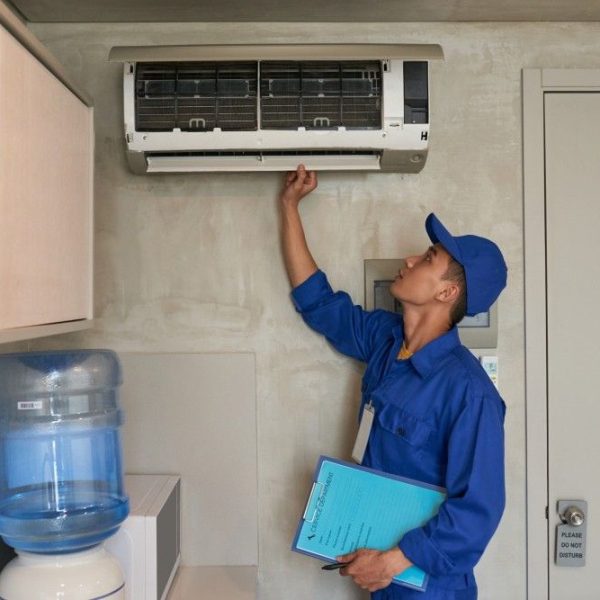 professional inspecting ac